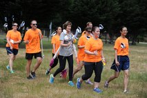 U.S. Airmen with the 446th Aeromedical Evacuation Squadron run and sing jodies as part of the first ever 446th AES amazing race morale event, June 2, 2018 at Joint Base Lewis-McChord Wash. (U.S. Air Force photo by Master Sgt. Minnette Mason)