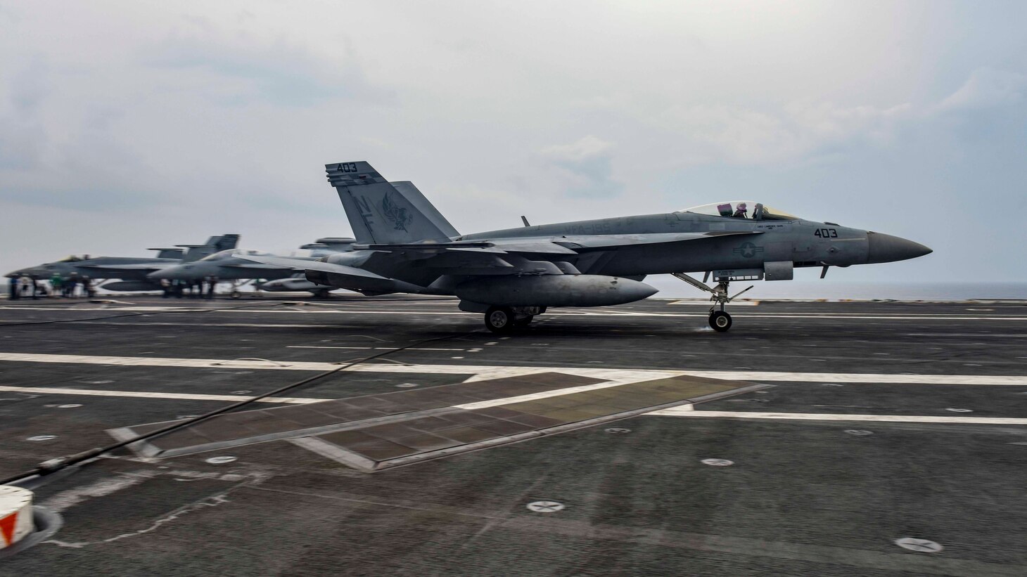 An F/A-18E Super Hornet, assigned to Strike Fighter Squadron (VFA) 195, lands on the flight deck during carrier qualifications with the Navy's forward-deployed aircraft carrier, USS Ronald Reagan (CVN 76), and Carrier Air Wing 5. Ronald Reagan, the flagship of Carrier Strike Group 5, provides a combat-ready force that protects and defends the collective maritime interests of its allies and partners in the Indo-Pacific region.