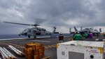 An MH-60S Sea Hawk, assigned to Helicopter Sea Combat Squadron (HSC) 12, lands on the flight deck during carrier qualifications with the Navy's forward-deployed aircraft carrier, USS Ronald Reagan (CVN 76), and Carrier Air Wing 5. Ronald Reagan, the flagship of Carrier Strike Group 5, provides a combat-ready force that protects and defends the collective maritime interests of its allies and partners in the Indo-Pacific region.