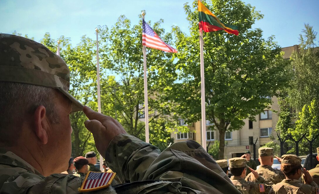 Service members from the United States, Lithuania, and several other nations participate in a ceremony at Vilnius, Lithuania