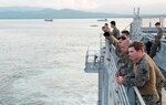 Fleet Anti-Terrorism Secruity Team Pacific Marines watch as USNS Millinocket (T-EPF 3) pulls into Puerto Princesa during a U.S. 7th Fleet theater security cooperation patrol. More than 40 members of the 7th Fleet staff are currently embarked on Millinocket visiting several countries in the Indo-Pacific region.