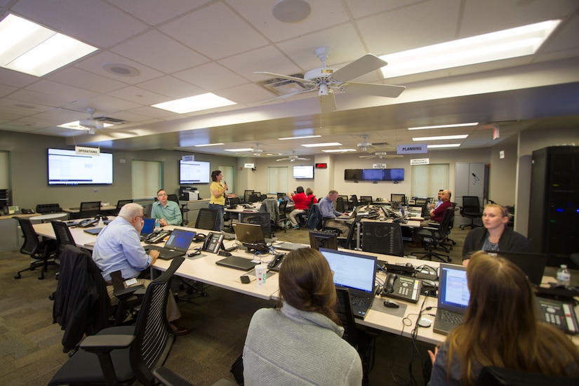 Representatives from federal, state and local agencies work on finalizing details for the Lower Virginia Peninsula Coastal Resilience Tournament. The tournament is a game where teams compete to develop flood risk investments that reduce the greatest amount of risk while managing local budgets and citizen response.