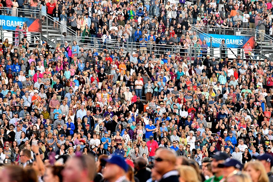 CCrowds cheer during the opening ceremony of the Department of Defense Warrior Games at the U.S. Air Force Academy in Colorado Springs, Colorado, June 2, 2018. First held in Colorado Springs in 2010, the Warrior Games were established as a way to expose service members who were wounded, ill or injured to adaptive sports. The Air Force is the host service for this year's Games. (U.S. Air Force photo by Staff Sgt. Rusty Frank)
