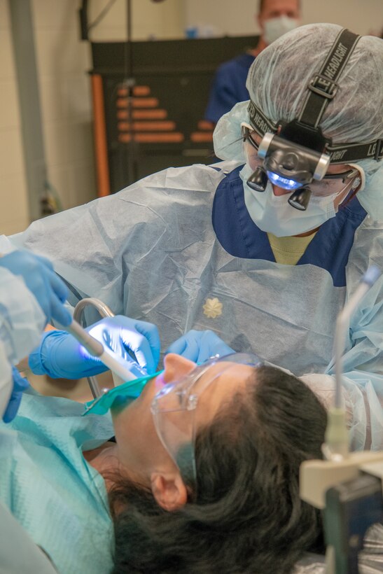 U.S. Air Force Maj. Matthew Moberg, 42nd Aerospace Medicine Squadron, Maxwell, Air Force Base, perform a dental procedure May 10, 2018, at Georgia Southern University in Savannah Georgia for Operation Empower Health. The Innovative Readiness Training is a U.S. military training opportunity that provides real-life deployment training and readiness for military personnel while addressing public and civil-society needs. (U.S. Air National Guard Photo by Tech. Sgt. John Galvin)