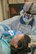 U.S. Air Force Maj. Matthew Moberg, 42nd Aerospace Medicine Squadron, Maxwell, Air Force Base, perform a dental procedure May 10, 2018, at Georgia Southern University in Savannah Georgia for Operation Empower Health. The Innovative Readiness Training is a U.S. military training opportunity that provides real-life deployment training and readiness for military personnel while addressing public and civil-society needs. (U.S. Air National Guard Photo by Tech. Sgt. John Galvin)