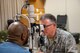 U.S. Air Force Col. Dan Perala, optometrist with the 153rd Airlift Wing performs an eye exam, May 11, 2018 at the Savannah Civic Center in support of Operation Empower Health Greater Savannah. The Innovative Readiness Training is a U.S. military training opportunity that provides real-life deployment training and readiness for military personnel while addressing public and civil-society needs. (U.S. Air National Guard Photo by Tech. Sgt. John Galvin)