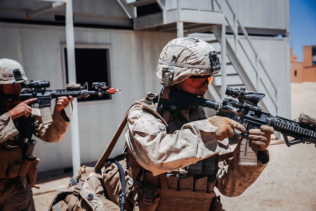 Marines do a building-to-building clearing during an integrated training exercise.