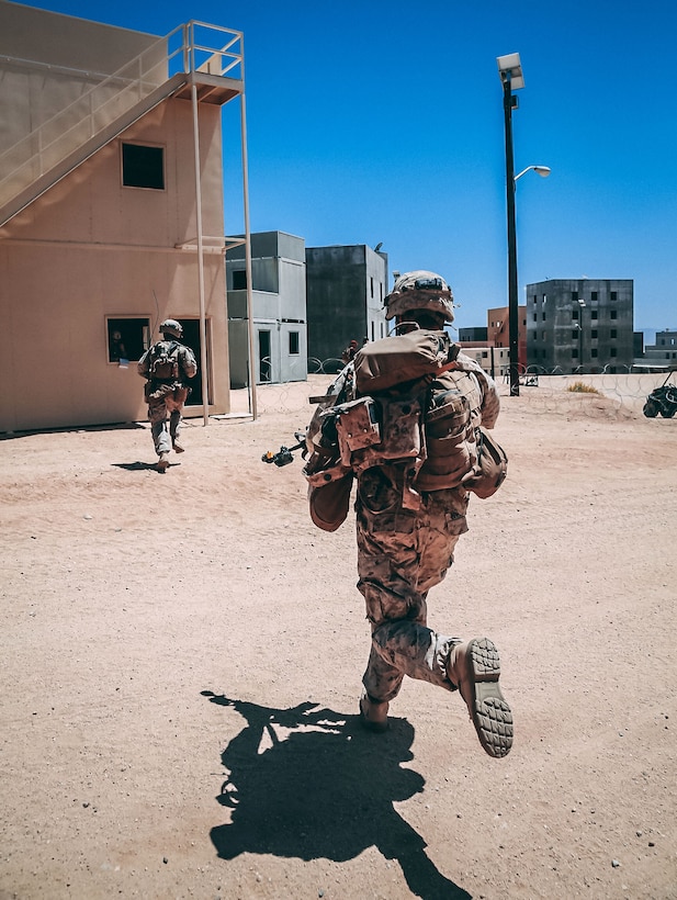 A Marine clears a building during the training exercise.