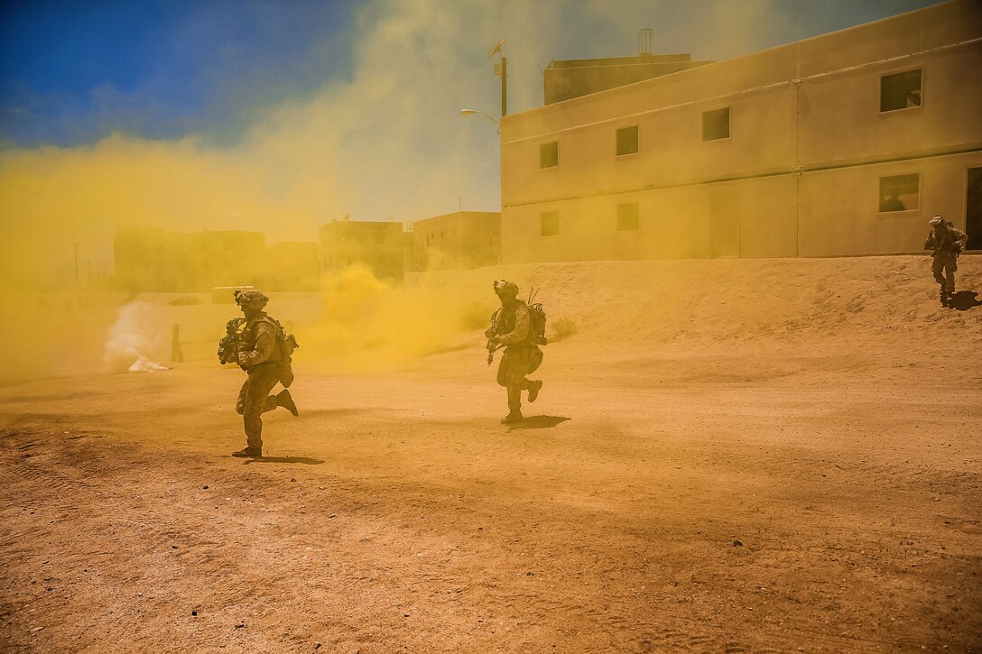 Marines run through a smoke run during Integrated Training Exercise.