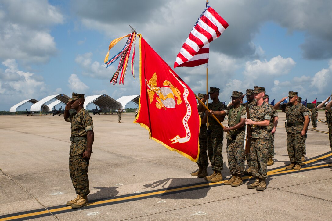 Sgt. Maj. Rodney L. Lane, sergeant major of 4th Marine Aircraft Wing, salutes as colors are presented during his relief and appointment ceremony held at the Marine Light Attack Helicopter Squadron 773, Marine Aircraft Group 49, 4th MAW, flight line, New Orleans, June 2, 2018. Lane relinquished his duties to Sgt. Maj. Thomas M. Burkhardt, who will post as the new sergeant major for 4th MAW. (U.S. Marine Corps photo by Sgt. Melissa Martens)