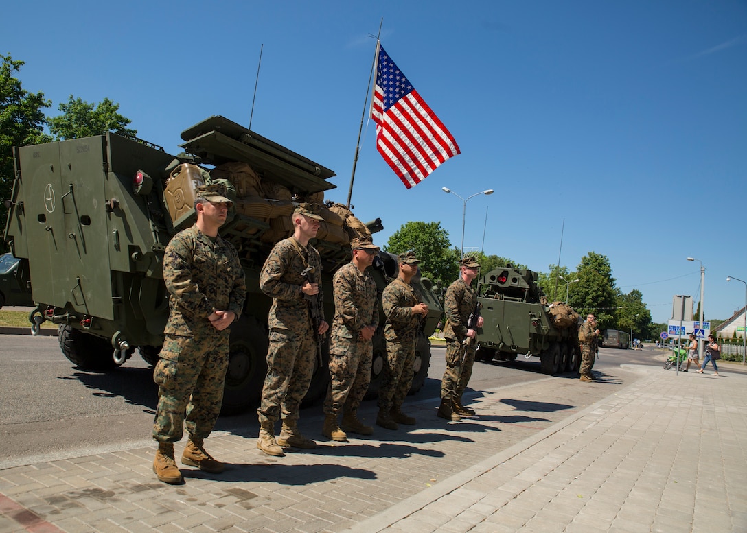 U.S. Marines participating in Exercise Saber Strike 18 stand outside of a U.S. Marine Corps Light Armored Vehicle (LAV) during a static-display event demonstrating military vehicles and gear in Kuršėnai, Lithuania, June 1, 2018. The multinational civil engagement gave the citizens of Kuršėnai the opportunity to interact with the different militaries involved in Exercise Saber Strike 18. Saber Strike is a U.S. joint and multinational exercise conducted at various locations throughout the Baltic States and Poland. The annual exercise prepares Allies to respond to regional crises and enhance the NATO alliance throughout the region. (U.S. Marine Corps photo by Sgt. Adwin Esters/Released)