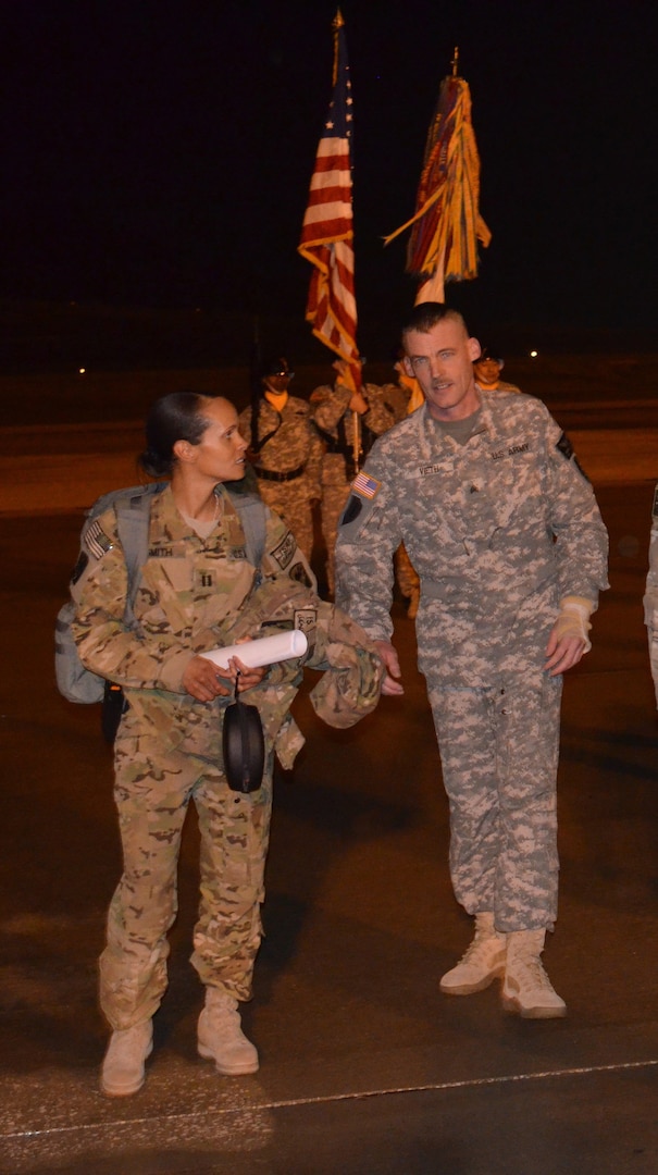 Sgt. Albert Vieth meets Capt. Nicole Washington at Fort Hood, Texas, upon the A, 1-168th GSAB's return from Afghanistan Feb. 9, 2013. Vieth was shot in the arm on a mission in Afghanistan on June 3, 2012.
