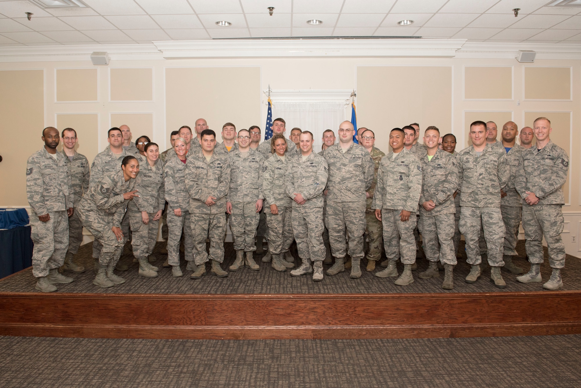 U.S. Airmen stand for a group photo after a Community College of the Air Force graduation ceremony at Shaw Air Force Base, S.C., May 18, 2018.