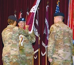 Lt. Gen. Nadja Y. West (left), commanding general, U.S. Army Medical Command and Army Surgeon General, passes the guidon to Brig. Gen. Jeffrey J. Johnson (center) during the Regional Health Command-Central change of command ceremony at Joint Base San Antonio-Fort Sam Houston May 31. Johnson assumed command from Maj. Gen. Thomas R. Tempel, Jr. (right).