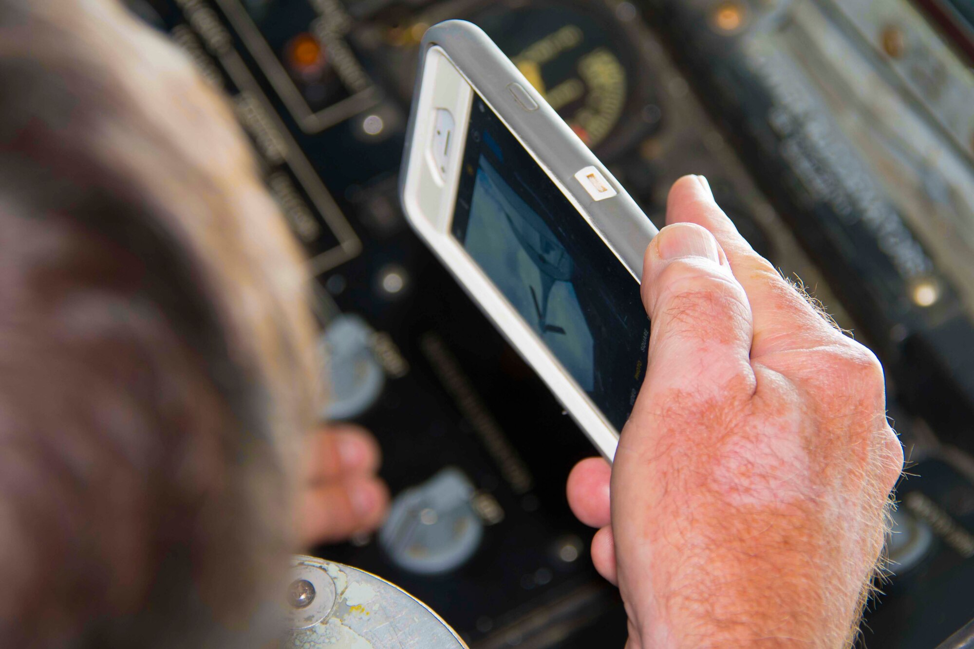A civic leader from the Greater Shreveport/Bossier City area snaps a picture of the boom on a KC-135 Stratotanker during a flight originating from Barksdale Air Force Base, Louisiana, May 30, 2018.  The flight was part of a Civic Leader Tour to Niagara Falls Air Reserve Station, New York.  The tour allowed local leaders to learn more about the other units within the military and gain a greater understanding of the broader Air Force mission.  (U.S. Air Force photo by Master Sgt. Ted Daigle/released)