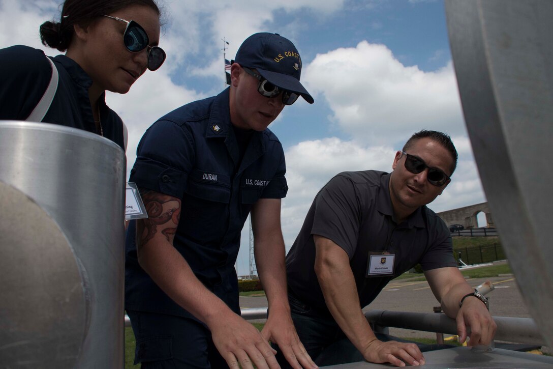 A U.S. Coast Guardsmen teaches Ashley Henning and Mario Chavez about the mission of Buffalo Sector of the USCG at Niagara Falls, New York, May, 31 2018.  Henning and Chavez, along with 28 other civilian leaders from the Greater Shreveport/Bossier City area, took part in a Civic Leader Tour hosted by the Niagara Falls Air Reserve Station, New York.  The tour allowed the leaders to learn more about Air Force and other military units outside Louisiana.  (U.S. Air Force photo by Master Sgt. Ted Daigle/released)