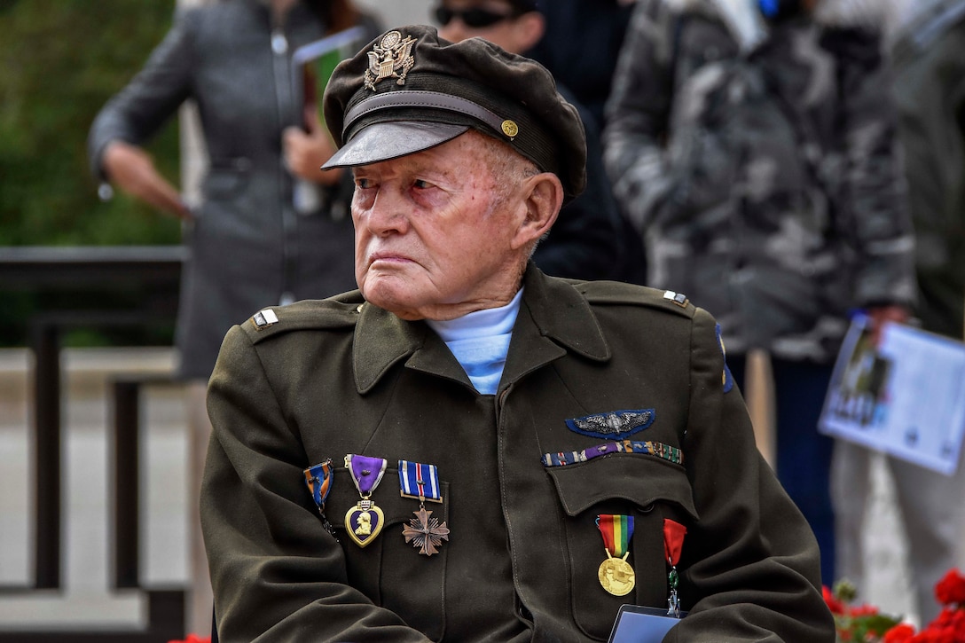 A veteran is honored during the 74th D-Day ceremony.