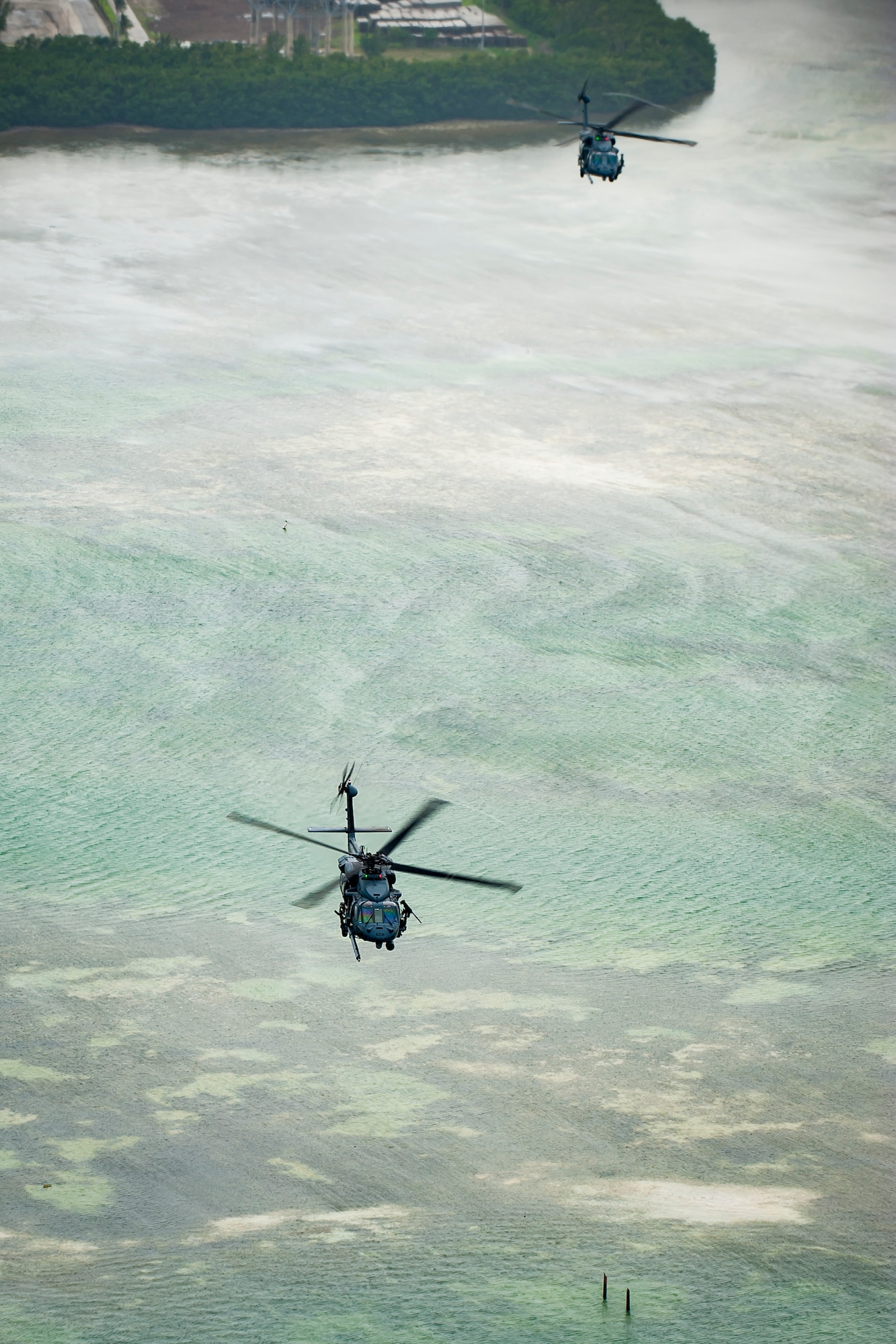 Air Force Reserve Citizen Airmen from the 301st Rescue Squadron out of Patrick Air Force Base in Cocoa Beach, Florida fly near Miami Beach aboard an HH-60G Pave Hawk helicopter on May 25th, 2018 during a practice run for the 2nd annual Salute to American Heroes Air and Sea Show over Miami Beach, Florida.  This two-day event showcases military fighter jets and other aircraft and equipment from all branches of the United States military in observance of Memorial Day, honoring servicemembers who have made the ultimate sacrifice. (U.S. Air Force photo/Staff Sgt. Jared Trimarchi)