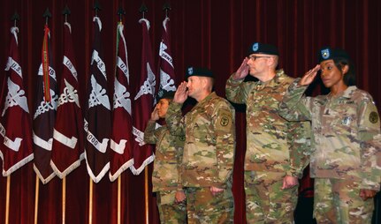 (From left) Regional Health Command-Central Command Sgt. Maj. Tabitha A. Gavia; Maj. Gen. Thomas R. Tempel, Jr., outgoing RHC-C commanding general; Brig. Gen. Jeffrey J. Johnson, incoming RHC-C commanding general; and Lt. Gen. Nadja Y. West, commanding general, U.S. Army Medical Command and Army Surgeon General, render a salute while the 323rd Army Band "Fort Sam's Own" plays ruffles and flourishes during the RHC-C change of command ceremony May 31. Johnson assumed command from Tempel during the ceremony.