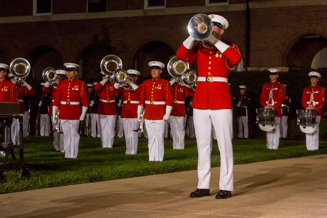 Corporal Brice Bach, bugler, “The Commandant’s Own” U.S. Marine Drum & Bugle Corps, performs a solo during the Friday Evening Parade at Marine Barracks Washington, June 1, 2018. The hosting official for the parade was Lt. Gen. Rex McMillian, commanding general, Marine Forces Reserve and Marine Forces North, and the guest of honor was retired Lt. Gen. Robert M. Shea, chairman of Marine Toys for Tots Foundation Board of Directors and president and CEO of the Armed Forces Communications and Electronics Association. (Official Marine Corps photo by Sgt. Robert Knapp/Released)