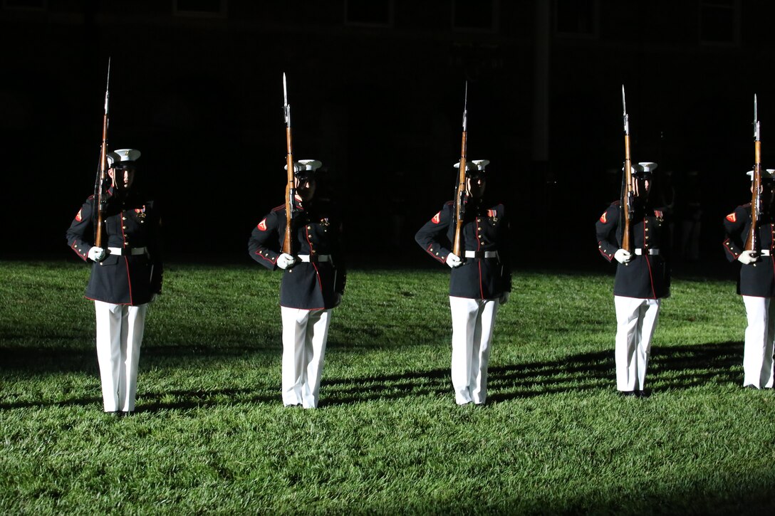 Marines with the U.S. Marine Corps Silent Drill Platoon stand at “steep right” during the Friday Evening Parade at Marine Barracks Washington D.C., June 1, 2018. The hosting official for the parade was Lt. Gen. Rex McMillian, commanding general, Marine Forces Reserve and Marine Forces North, and the guest of honor was retired Lt. Gen. Robert M. Shea, chairman of Marine Toys for Tots Foundation Board of Directors and president and CEO of the Armed Forces Communications and Electronics Association.