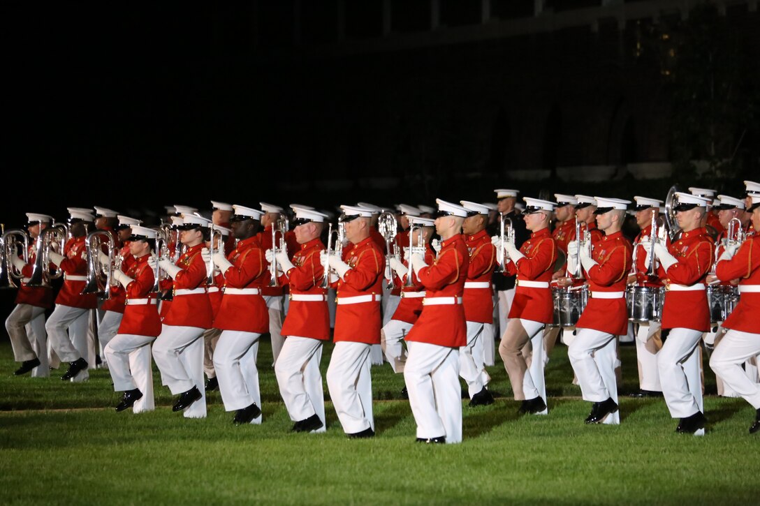 Marines with “The Commandant’s Own” U.S. Marine Drum & Bugle Corps march onto the parade deck during the Friday Evening Parade at Marine Barracks Washington D.C., June 1, 2018. The hosting official for the parade was Lt. Gen. Rex McMillian, commanding general, Marine Forces Reserve and Marine Forces North, and the guest of honor was retired Lt. Gen. Robert M. Shea, chairman of Marine Toys for Tots Foundation Board of Directors and president and CEO of the Armed Forces Communications and Electronics Association.