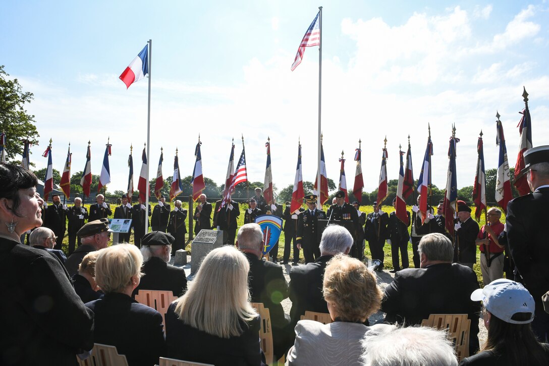 U.S Army Europe soldiers, World War II veterans, local leaders and residents gather at the General Eisenhower Monument in Tournieres, France.