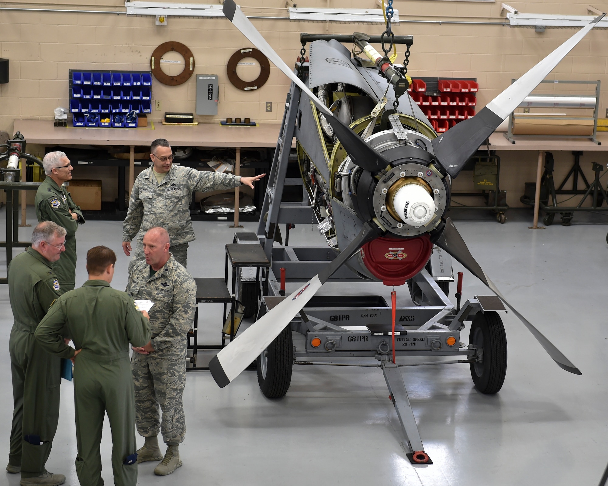 Maj. General Craig L. La Fave, the commander of the 22nd Air Force, receives a briefing by the 910th Aircraft Maintenance Squadron on the 910th Airlift Wing’s C-130H Hercules fleet engines in the engine shop on Youngstown Air Reserve Station June 2.
