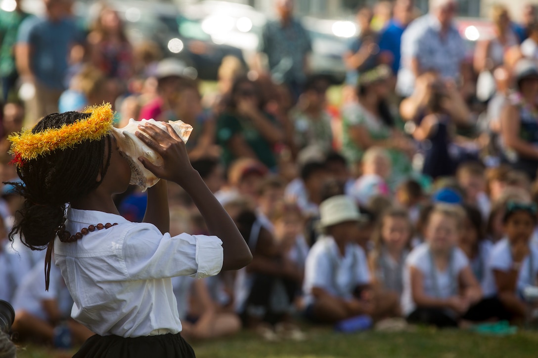 A student from Mokapu Elementary School sounds the conch shell during the school’s May Day celebration, Marine Corps Base Hawaii, May 25, 2018. May Day, which is also known as Lei Day, is a Hawaiian public holiday celebrated on May 1st every year, but was postponed due to student testing. Mokapu Elementary School's May Day includes the students performing traditional dances, singing of songs to celebrate Hawaiian culture with families and friends. (U.S. Marine Corps photo by Sgt. Zachary Orr)