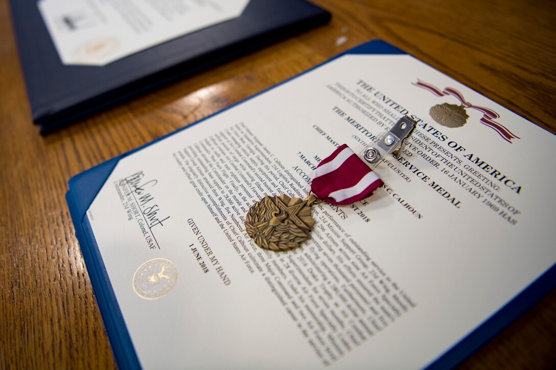 A Meritorious Service Metal awarded to Chief Master Sgt. Jim Calhoun, 23d Logistics Readiness Squadron superintendent, is displayed during Calhoun’s retirement ceremony, June 1, 2017, at Moody Air Force Base, Ga. Calhoun entered the Air Force in August of 1991 and served in numerous positions within fuels management and logistics readiness throughout his career. (U.S. Air Force photo by Senior Airman Daniel Snider)
