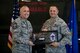 Chief Master Sgt. Bruce McPherson, 23d Mission Support Group (MSG) chief enlisted manager, presents a gift from the 23d MSG to Chief Master Sgt. Jim Calhoun, 23d Logistics Readiness Squadron superintendent, during Calhoun’s retirement ceremony, June 1, 2017, at Moody Air Force Base, Ga. Calhoun entered the Air Force in August of 1991 and served in numerous positions within fuels management and logistics readiness throughout his career. (U.S. Air Force photo by Senior Airman Daniel Snider)
