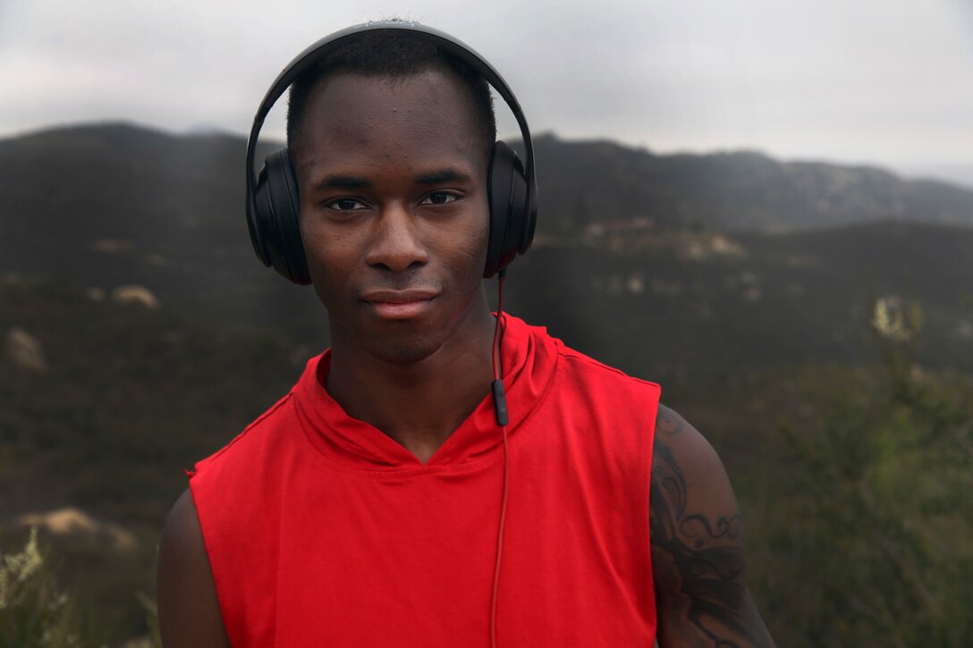 Cpl. Demetrius Doe, an administrative specialist with the installation personnel administration center (IPAC), stands atop Mount Woodson following a noncommissioned officer (NCO) hike in San Diego, May 18. The hikes purpose was to foster esprit de corps amongst the IPAC NCOs. (U.S. Marine Corps photo by Cpl. Jake M.T. McClung/Released)