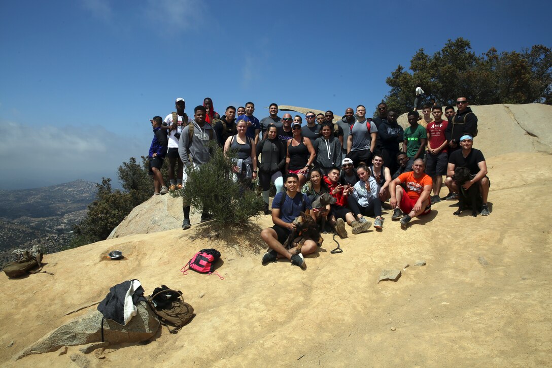 Noncommissioned officers (NCOs) with Marine Corps Air Station Miramar’s installation personnel administration (IPAC) stand atop Mount Woodson following a NCO hike to Potato Chip Rock in San Diego, May 18. The hikes purpose was to foster esprit de corps amongst the IPAC NCOs. (U.S. Marine Corps photo by Cpl. Jake M.T. McClung/Released)