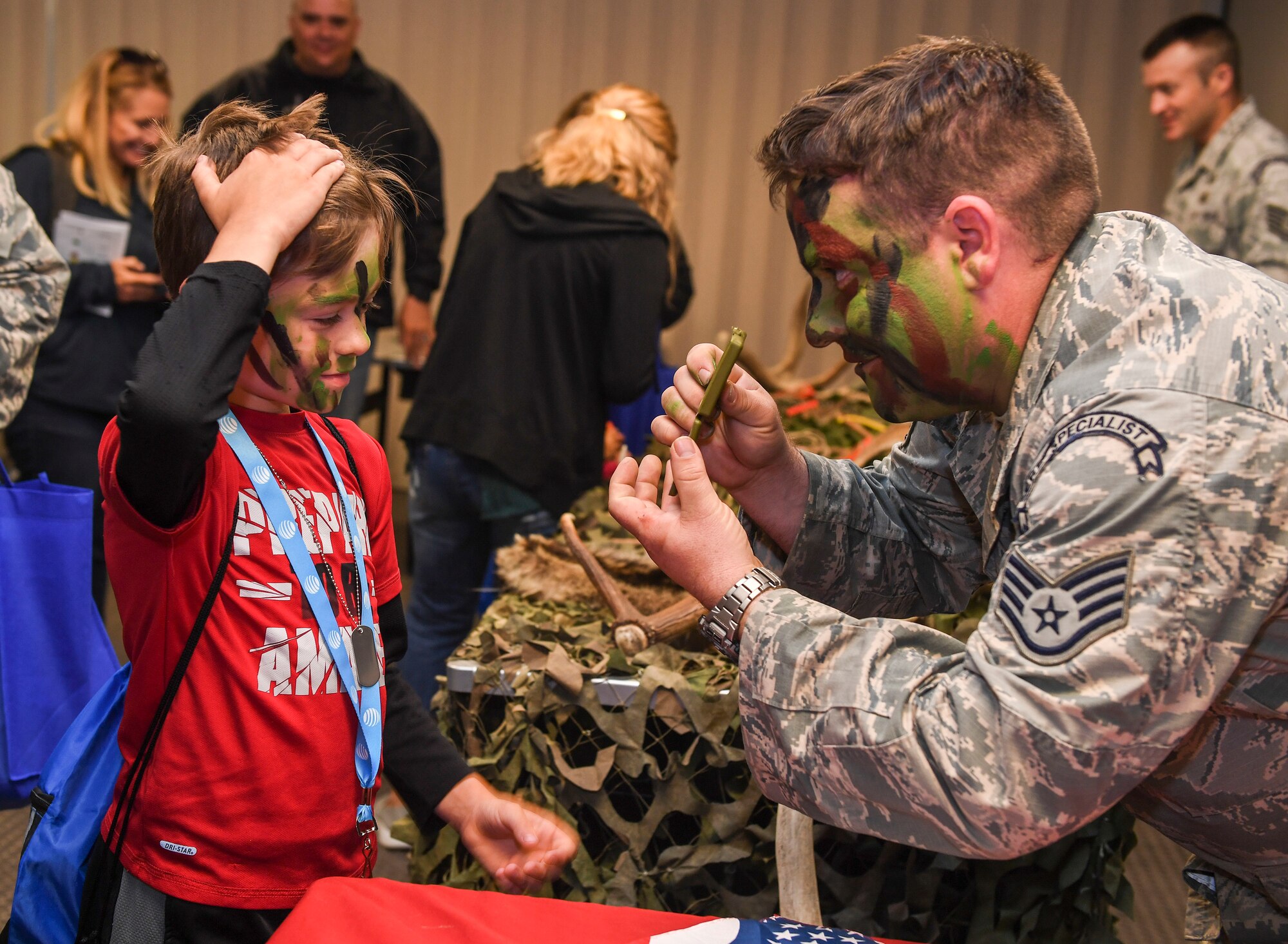 Operation Heroes is an annual event that allows children to experience a pre-departure briefing and demonstrations from more than 10 different units around base. During the event, children tasted Meals Ready-to-Eat, got their faces painted, saw Explosive Ordnance Disposal demonstrations and weapons displays.