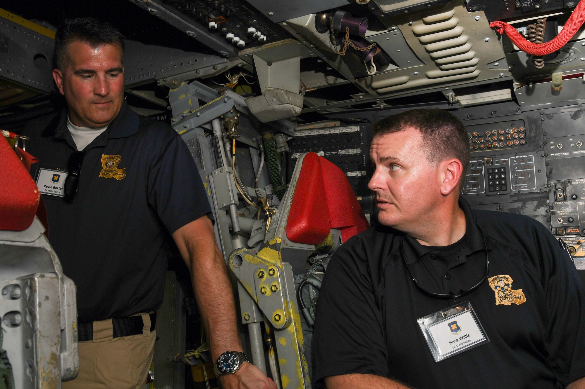 Kevin Baxter and Hack Willis, both with the Louisiana State Police, observe the interior of a B-52 Stratofortress at Barksdale Air Force Base, Louisiana, June 2, 2018.  They were on hand for the 307th Bomb Wing’s Employer Appreciation Day.  Reserve Citizen Airmen of the 307th BW nominated their employers to learn more about the unit’s mission.  (U.S. Air Force photo by Staff Sgt. Callie Ware/released)