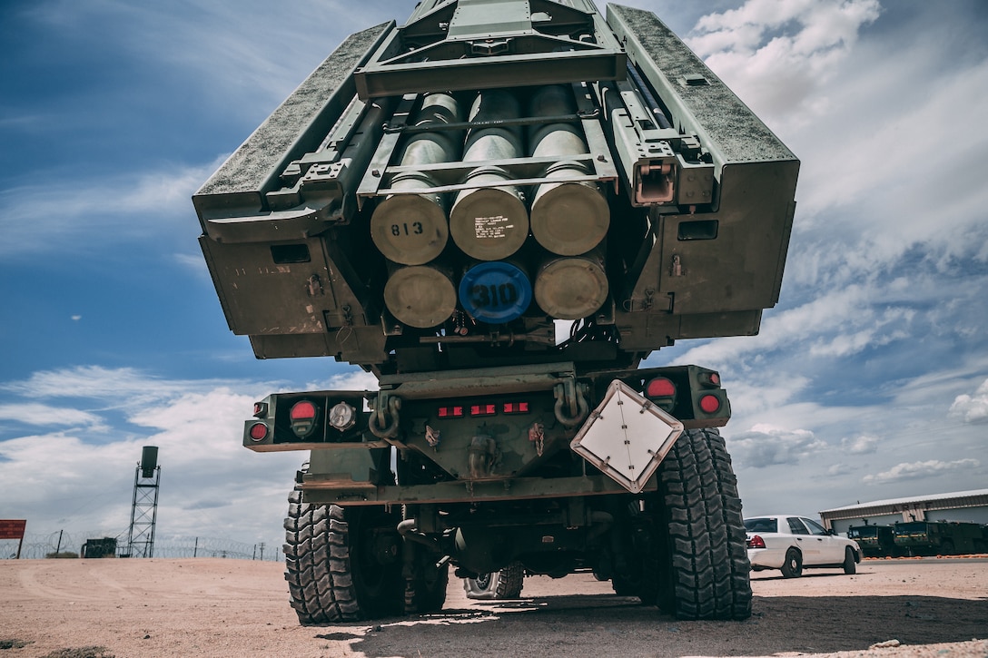 Marines with 5th Battalion, 11th Marine Regiment, 1st Marine Division, arrive at one of their launch positions with the High-Mobility Artillery Rocket System at the Air Combat Element landing strip as a part of Integrated Training Exercise 3-18 aboard the Marine Corps Air Ground Combat Center, Twentynine Palms, Calif., May 21, 2018. The purpose of ITX is to create a challenging, realistic training environment that produces combat-ready forces capable of operating as an integrated MAGTF. (U.S. Marine Corps photo by Lance Cpl. William Chockey)