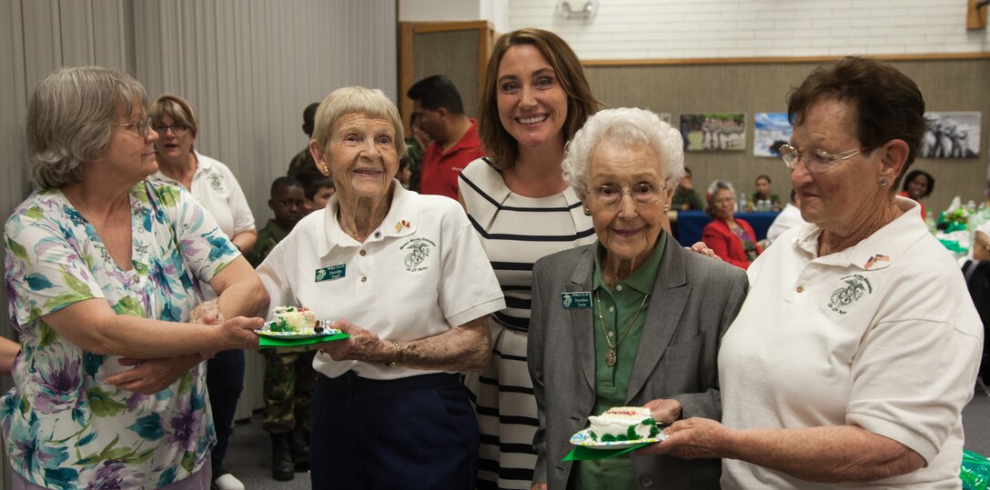 Dorothy Angil, (left) Dorothy Irwin, (right) and Amber Bilderain, Protocol Specialist, Marine Corps Community Services, (center) receive cake in recognition of the Marine Corps’ traditional cake cutting ceremony at the Women Marines Association luncheon at the Church of Jesus Christ of Latter-day Saints, Twentynine Palms, Calif., May 19, 2018. The ceremony represents passing knowledge from the oldest to the youngest Marines present. (U.S. Marine Corps photo by Lance Cpl. Carley Vedro)
