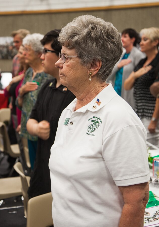 Marine Corps Lt. Col. Elaine Bowden, ret., stands for the National Anthem and Marines’ Hymn during the Women Marines Association luncheon at the Church of Jesus Christ of Latter-day Saints, Twentynine Palms, Calif., May 19, 2018. The luncheon was held in honor of the 75th anniversary of WMA and 100 years of women Marines serving. (U.S. Marine Corps photo by Lance Cpl. Carley Vedro)