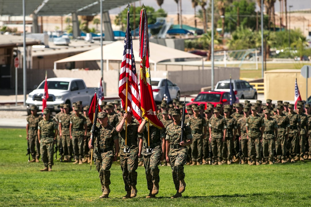 The 2nd Battalion, 7th Marine Regiment color guard retires the colors at the change of command ceremony of Lt. Col. Jonathan Q. Kenney, off-going commanding officer, 2nd Battalion, 7 Marine Regiment, to Lt. Col. Stuart W. Glenn, on-coming commanding officer, 2/7, at Lance Cpl. Torrey L. Grey Field aboard the Marine Corps Air Ground Combat Center, May 22, 2018. Kenney served as the commanding officer of 2/7 since December of 2016 and is scheduled to report to Naval War College, Newport, RI, in July 2018. (U.S. Marine Corps photo by Lance Cpl. Margaret Gale)