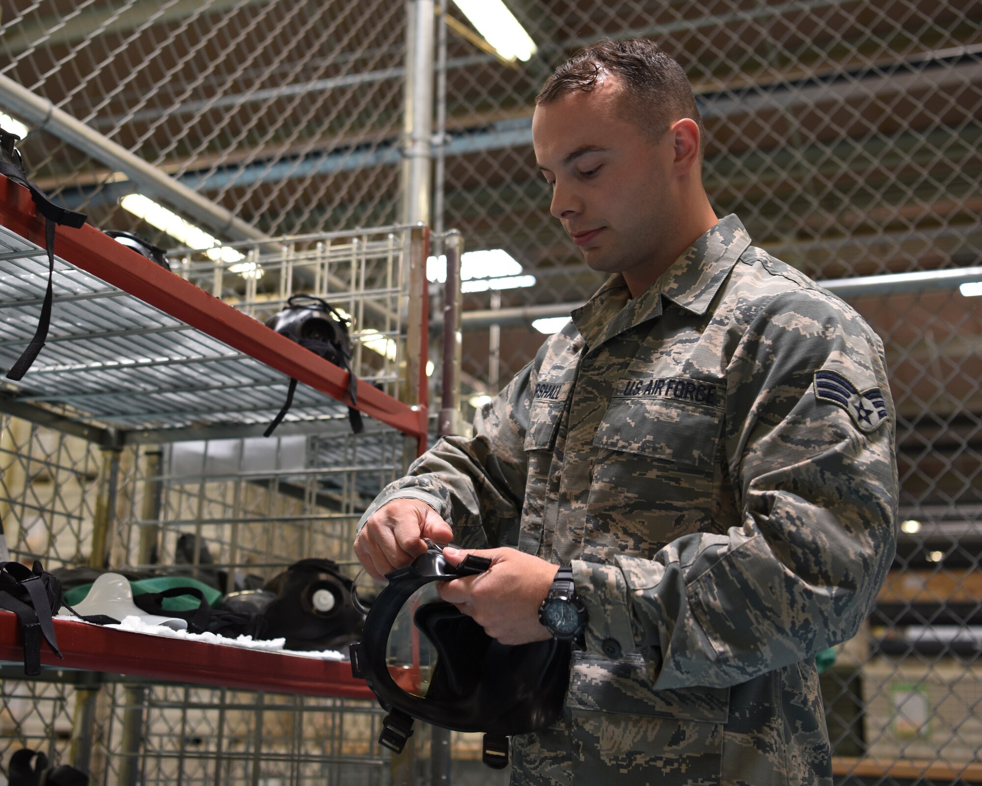 Senior Airman Tyler Marshall, 56th Logistics Readiness Squadron Individual Protection Equipment journeyman, assembles a gas mask June 4, 2018 at Luke Air Force Base, Ariz.