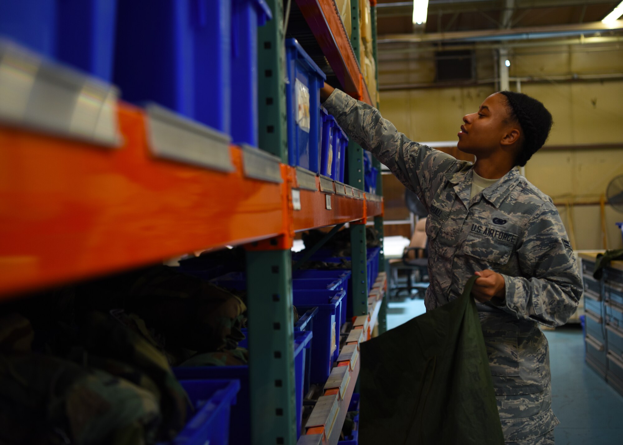 Airman 1st Class Jasmyn Marshall, 56th Logistics Readiness Squadron Individual Protection Equipment journeyman, grabs supplies for a deployment pack June 4, 2018 at Luke Air Force Base, Ariz.