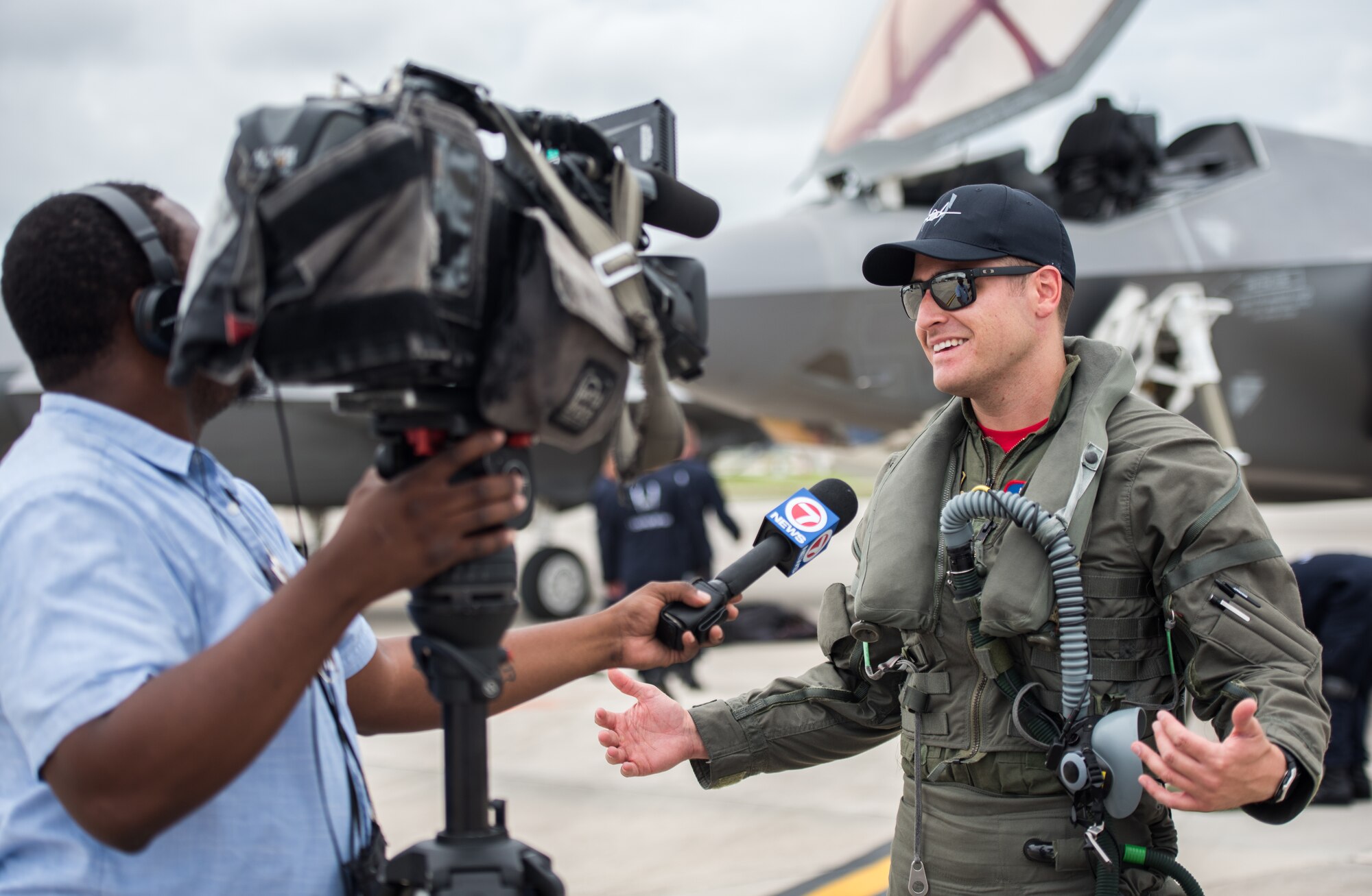 Capt. Andrew “Dojo” Olson, F-35 Heritage Flight Team commander and pilot, speaks to the media during an interview at the Miami-Opa Locka Executive Airport in Opa-Locka, Fla., May 24, 2018. During the interview, Olson spoke about the capabilities of the F-35A Lightning II and what air show guests can expect to see during its performance. (U.S. Air Force photo by Airman 1st Class Alexander Cook)