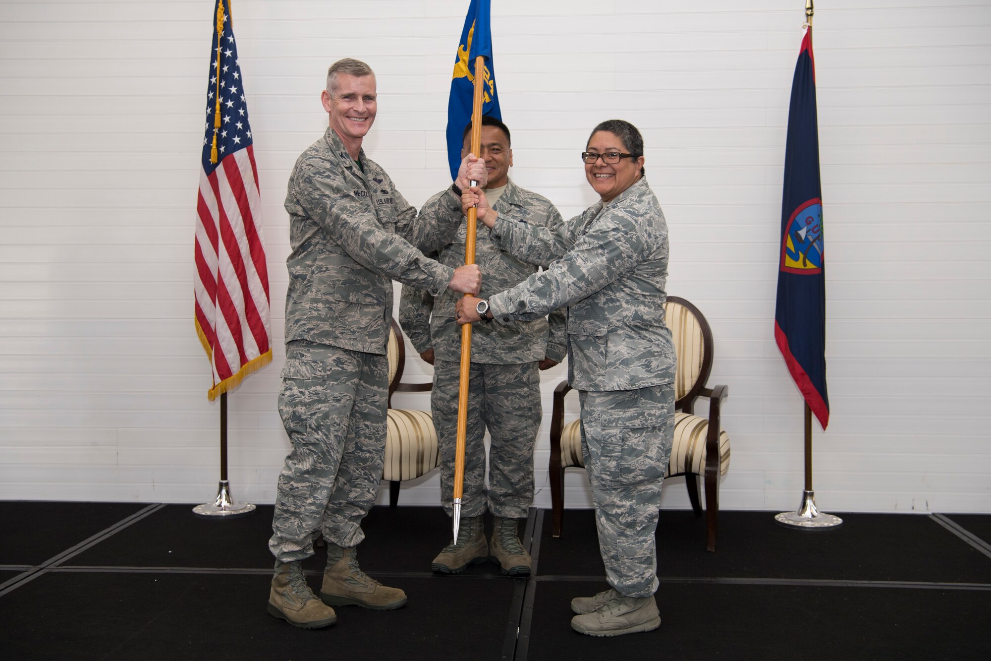U.S. Air Force Col. Brian McCullagh, 624th Regional Support Group commander, gives Lt. Col. Carla Lugo command of the 44th Aerial Port Squadron during an assumption of command ceremony at Andersen Air Force Base, Guam, June 2, 2018.