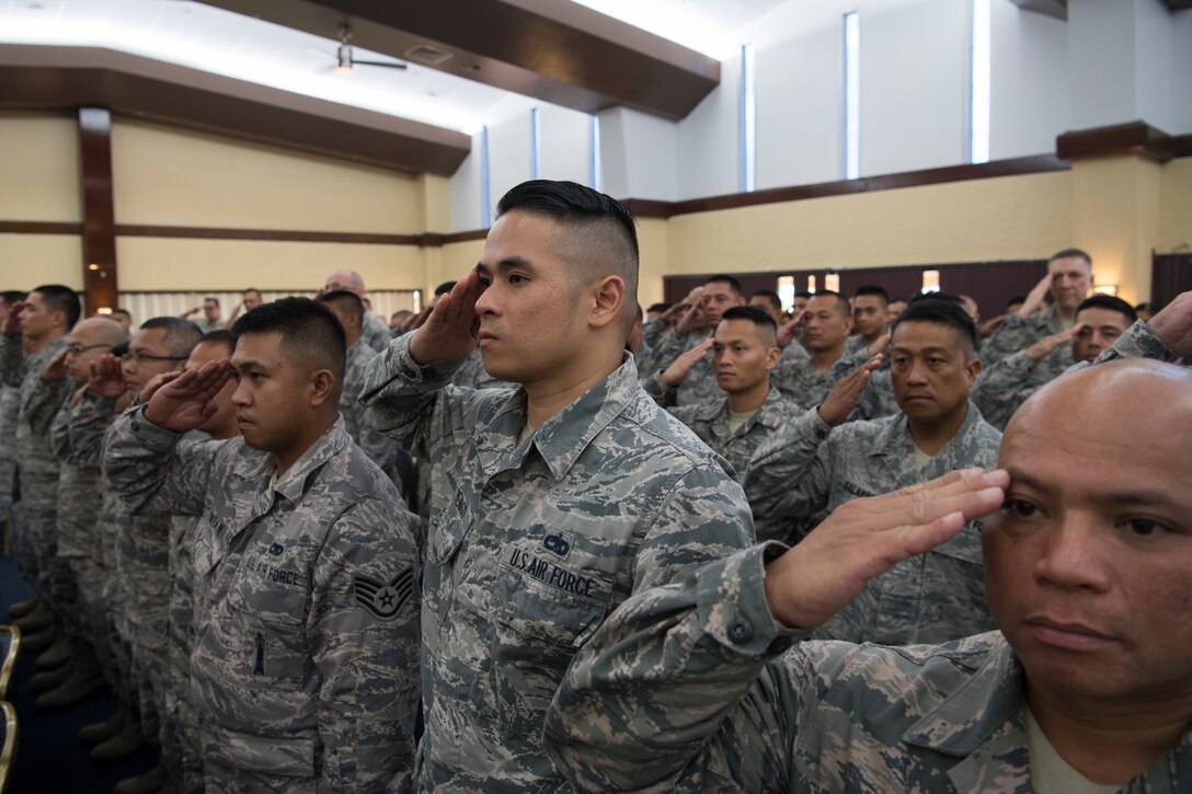 U.S. Air Force Reserve members from the 44th Aerial Port Squadron present Lt. Col. Carla Lugo with her first salute as the 44th APS commander during an assumption of command ceremony at Andersen Air Force Base, Guam, June 2, 2018.