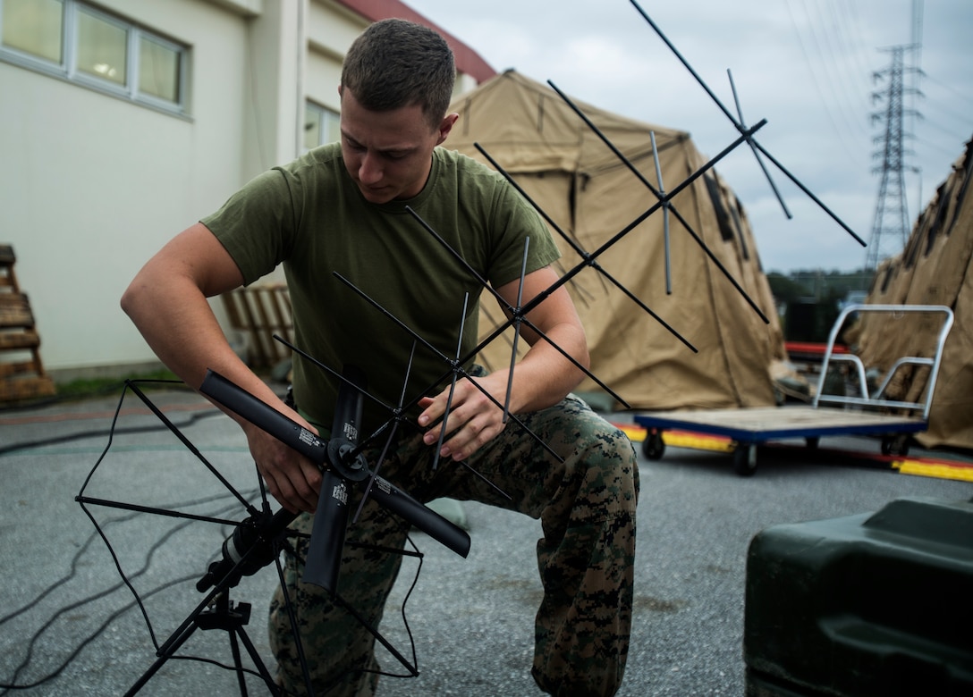 Cpl. Parker J. Berg adjusts an antenna during exercise Warrior Challenge 18 on Camp Foster, Okinawa, Japan, Jan. 24, 2018. Warrior Challenge 18, Marine Wing Communications Squadron 18’s internal squadron exercise, increases Marine’s technical skills, builds unit cohesion, and rehearses the communications support prior to the execution of Key Resolve 18.