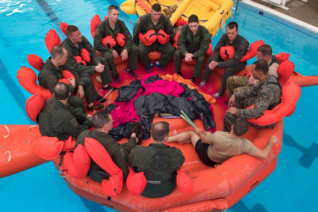 Airmen participate in the water survival training.