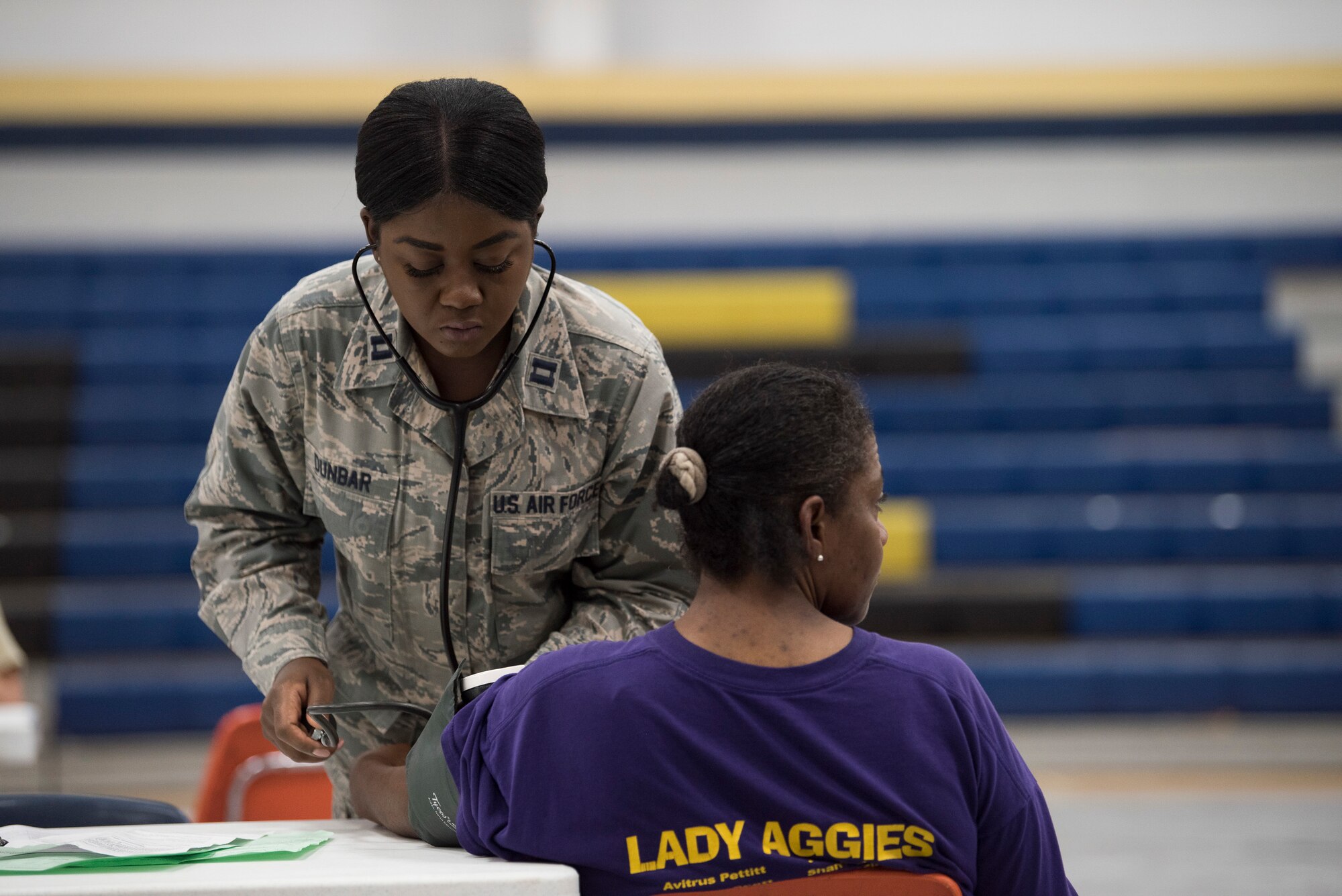 Capt. Nikita Dunbar, an Air National Guard critical-care nurse from the 187th Fighter Wing CERFP in Montgomery, Ala., takes a patient's blood pressure at the Alabama Wellness Innovative Readiness Training at Monroe County High School in Monroeville, Ala., June 3, 2018. Air Guardsmen from Alabama and Wisconsin were part of the joint force participating in the two-week training that provided no-cost health care to the citizens of lower Alabama. (US Air National Guard photo by Staff Sgt. Jared Rand)