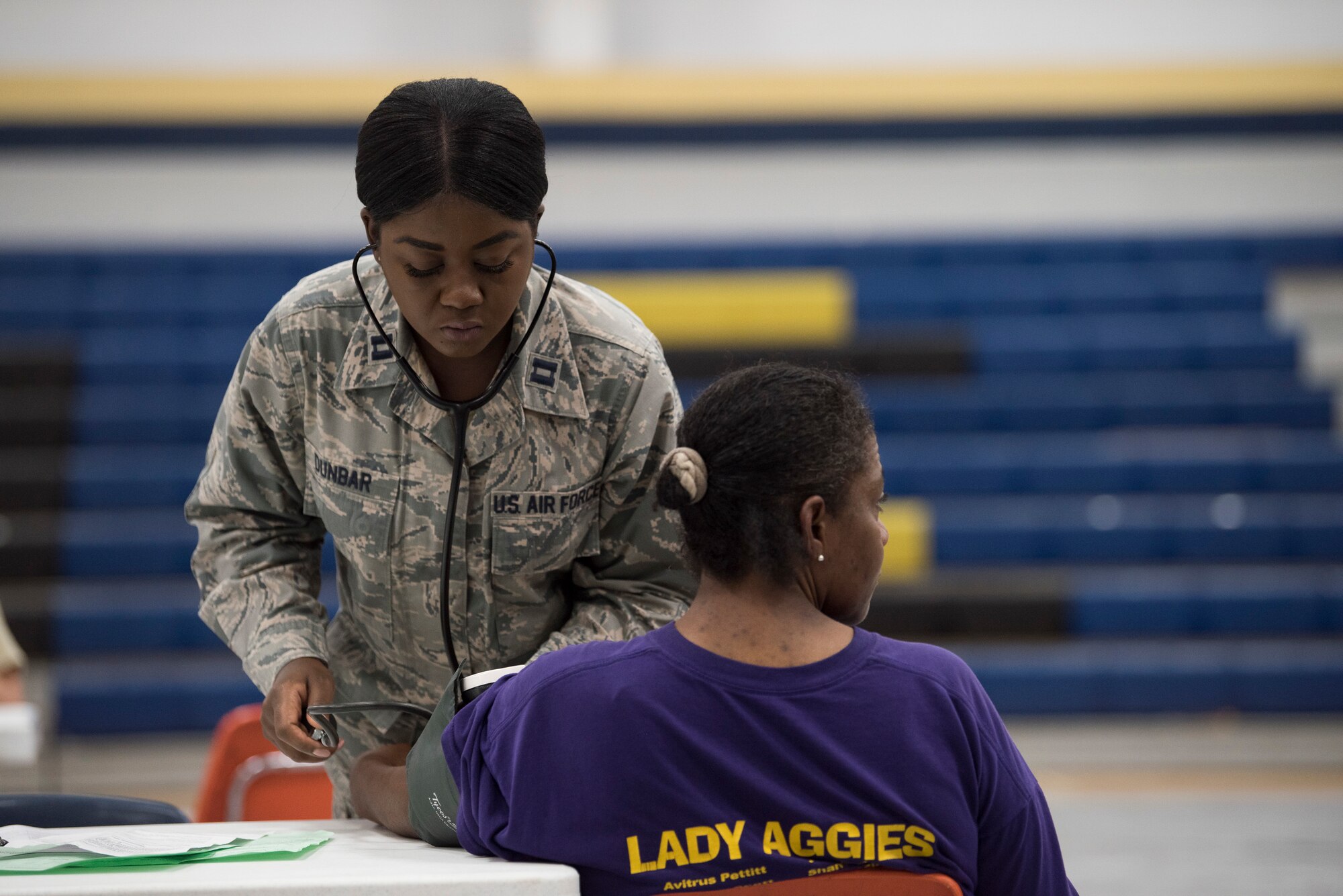 Capt. Nikita Dunbar, an Air National Guard critical-care nurse from the 187th Fighter Wing CERFP in Montgomery, Ala., takes a patient's blood pressure at the Alabama Wellness Innovative Readiness Training at Monroe County High School in Monroeville, Ala., June 3, 2018. Air Guardsmen from Alabama and Wisconsin were part of the joint force participating in the two-week training that provided no-cost health care to the citizens of lower Alabama. (US Air National Guard photo by Staff Sgt. Jared Rand)