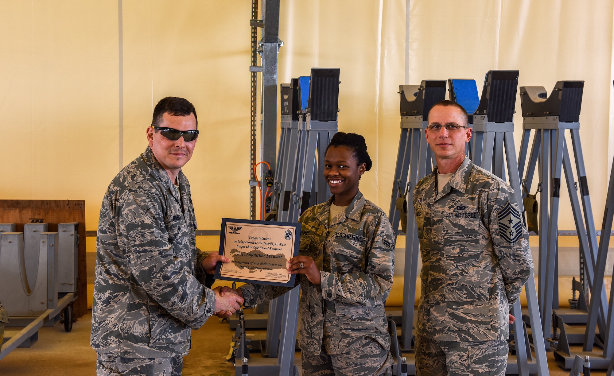 Airman 1st Class Sojourner Stewart poses for the Incirlik Air Base Larger Than Life award