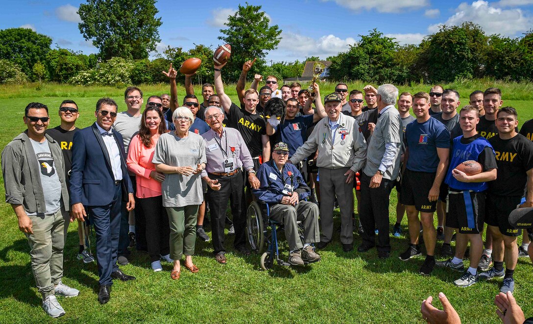 Soldiers from the 101st Airborne Division, WWII veterans, Helen Patton, the granddaughter of the late Gen. George S. Patton, and local leaders pose for a group photo